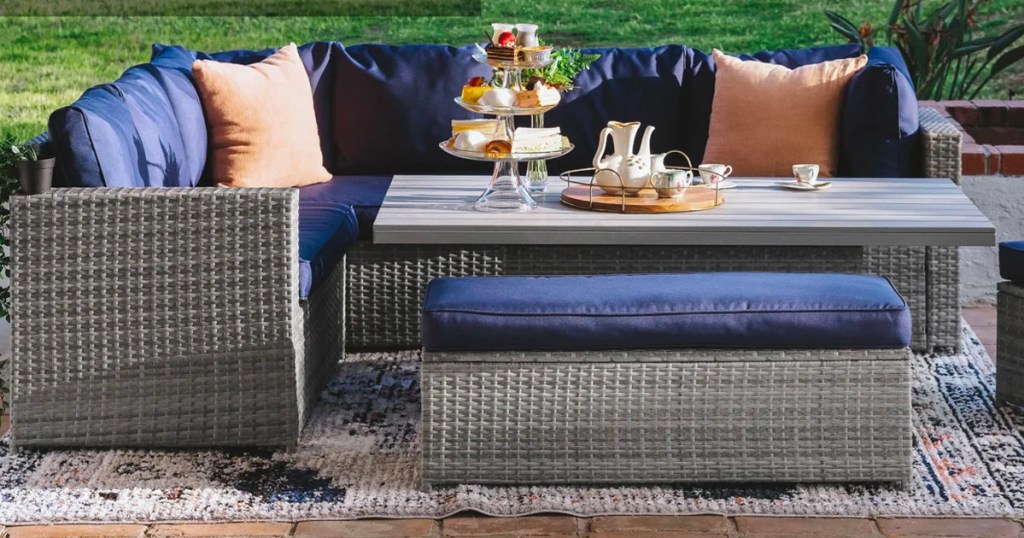 gray and blue 6 piece wicker dining set on patio