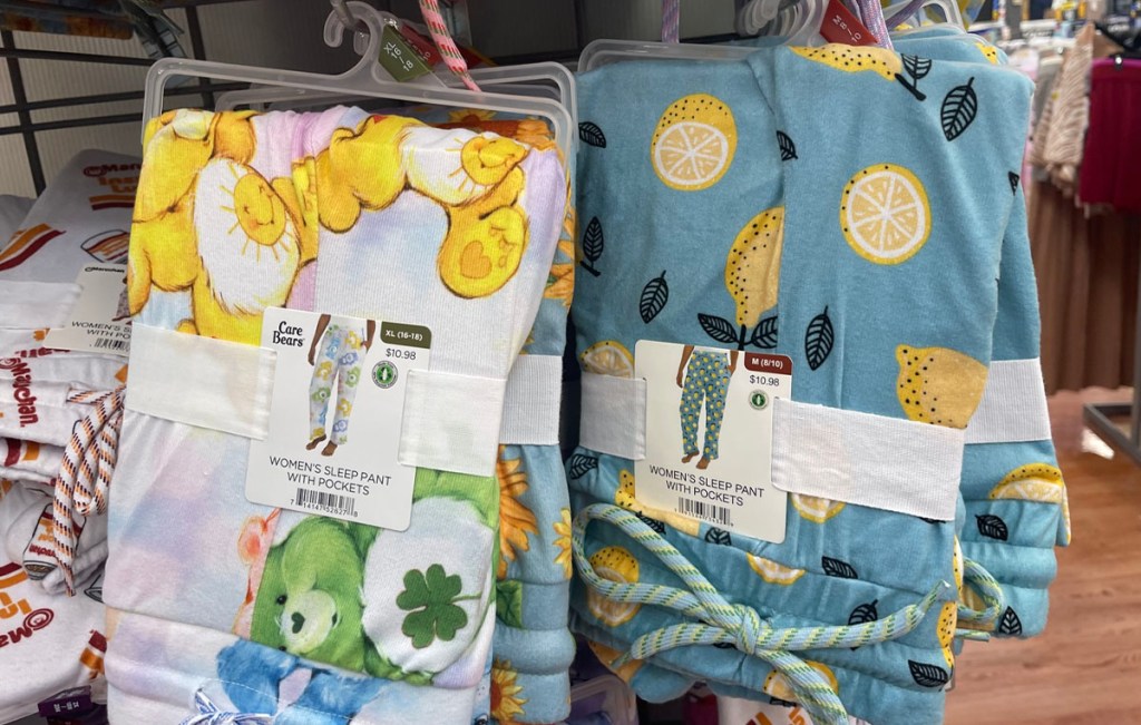 care bear and lemon pajama pants hanging on shelf