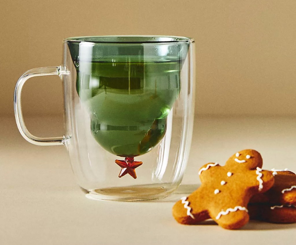 glass coffee mug with upside down christmas tree inside