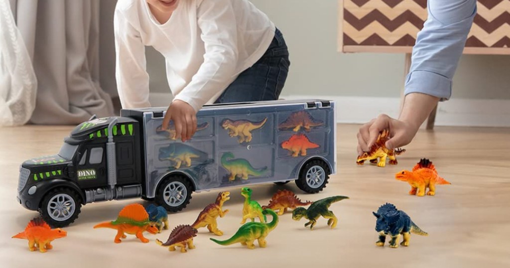 kids playing with dinosaur truck set
