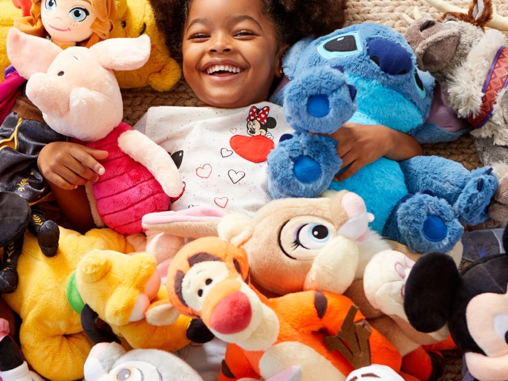 girl in pile of toys