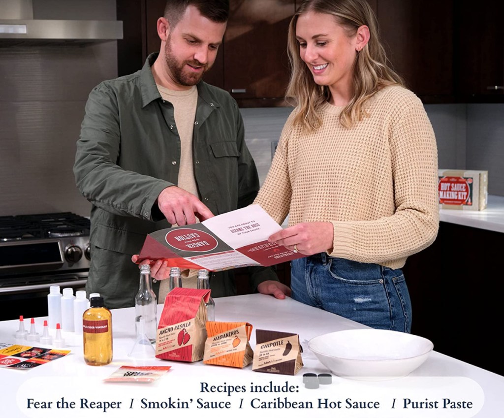 man and woman making various hot sauces