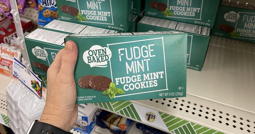 holding a box of Fudge Mint cookies
