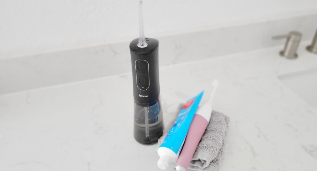 water flosser next to sink