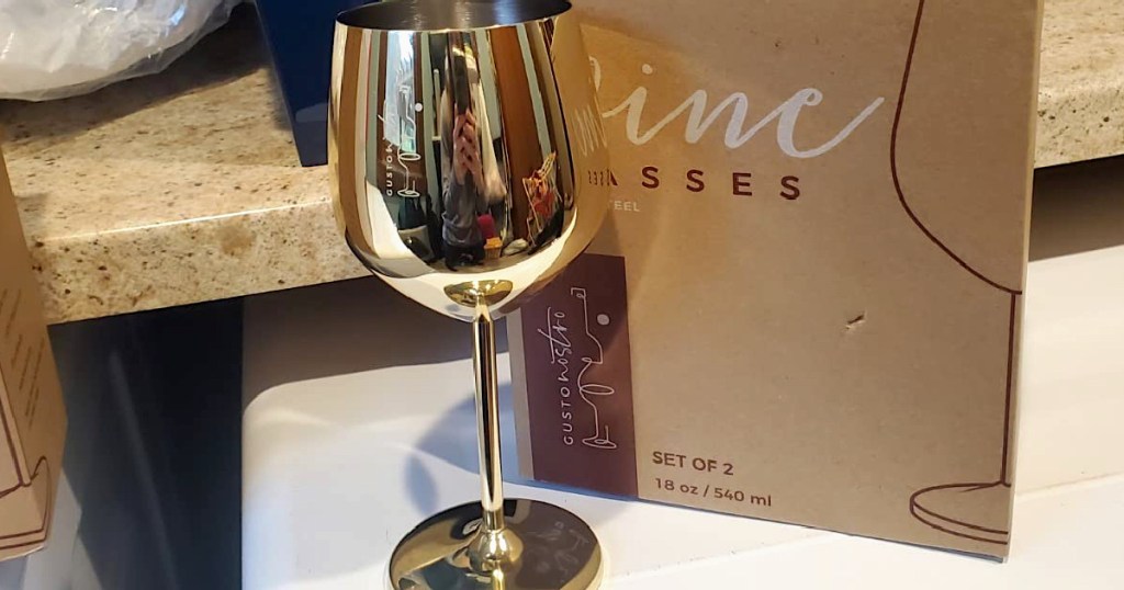 Gold wine glass by box 