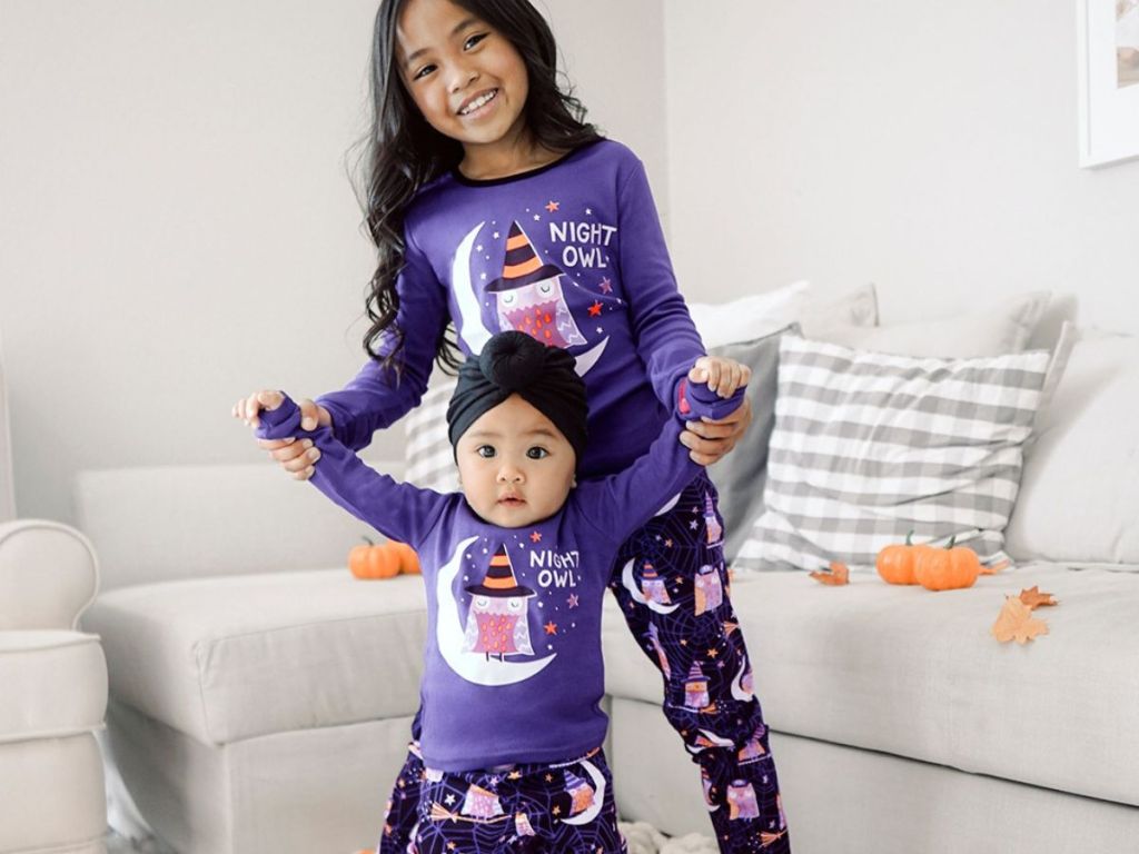 kids wearing Halloween pajamas