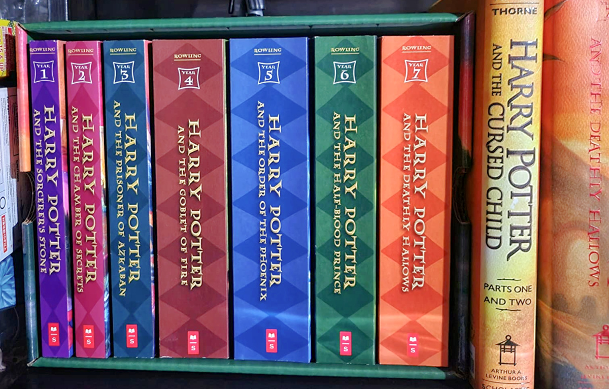 harry potter complete boxed set books lined up on a shelf