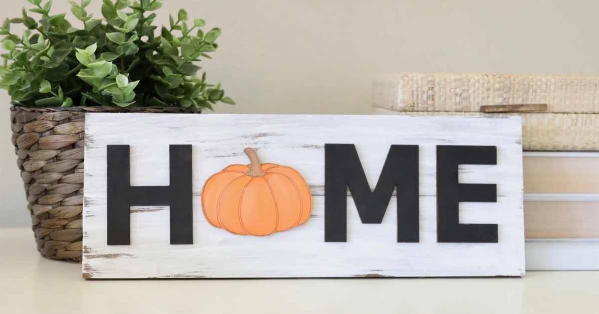 Changeable home sign with a pumpkin for the o in home.