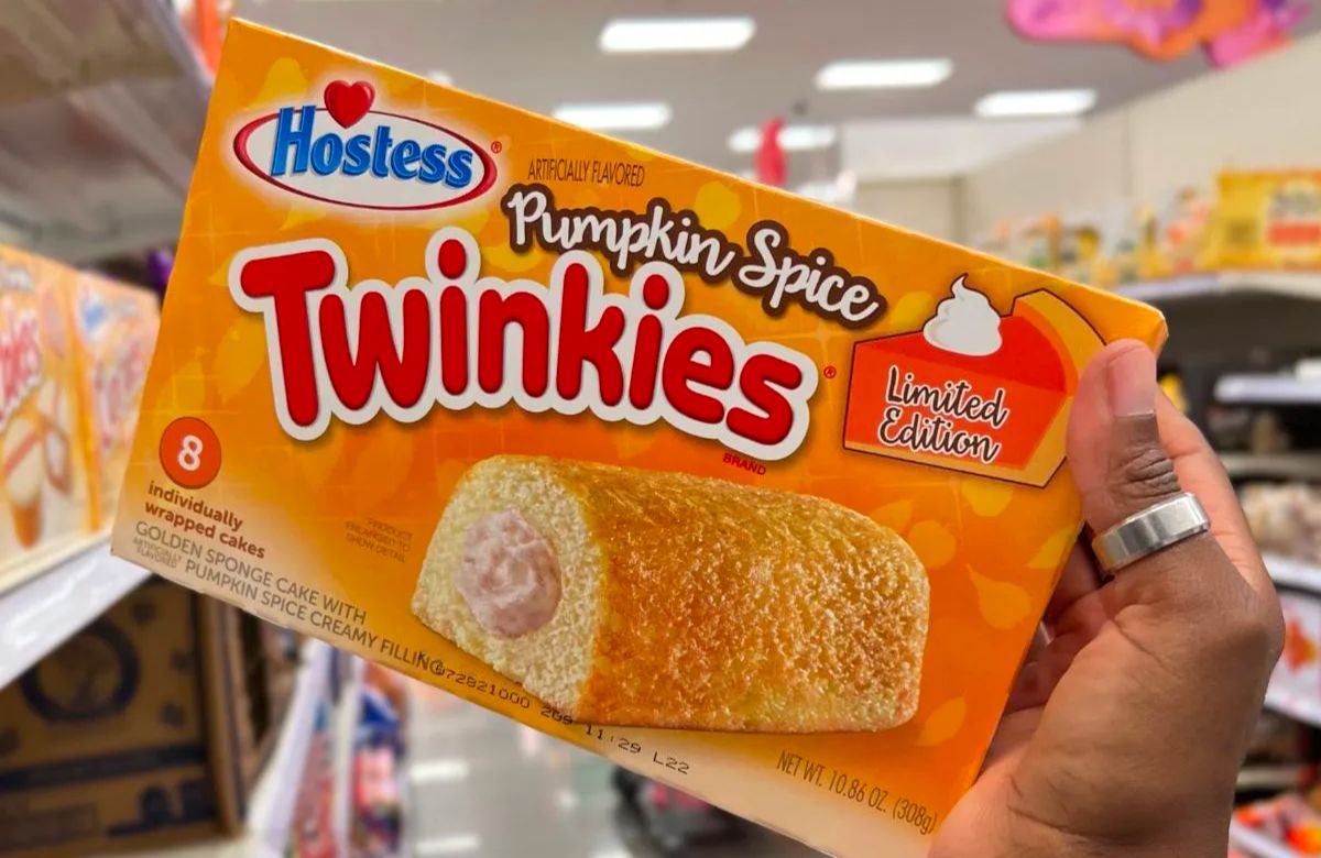 Hostess Iced Pumpkin Spice Twinkies 8 Count in woman's hand at Target