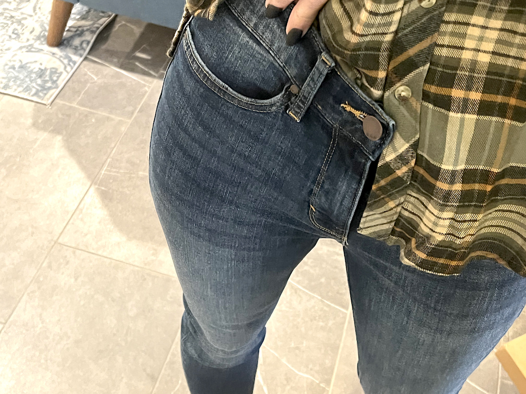 woman wearing JCPenney jeans and flannel