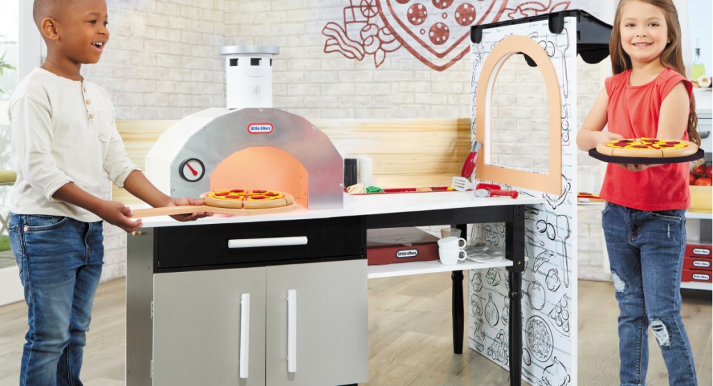 kids playing with toy pizza kitchen
