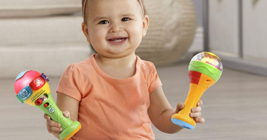 baby playing with leapfrog shakers