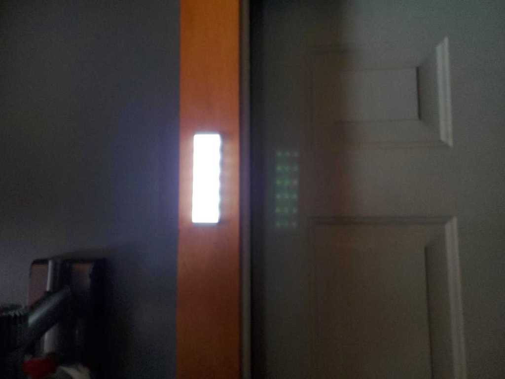 narrow light lit up on door casing in utility room