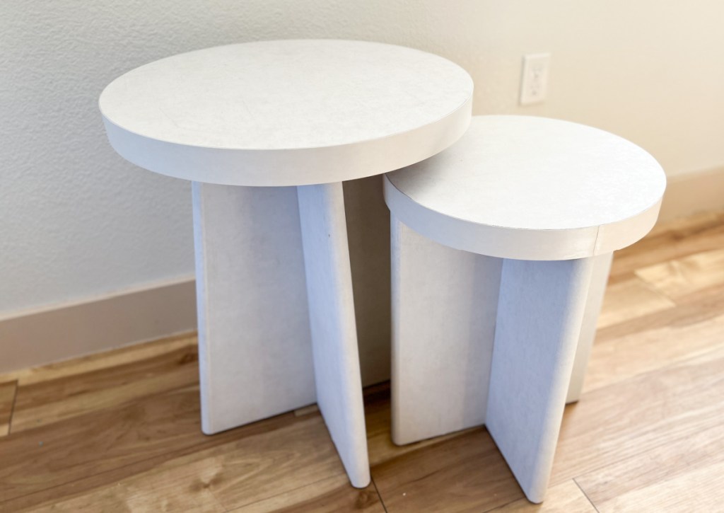 two white plaster tables
