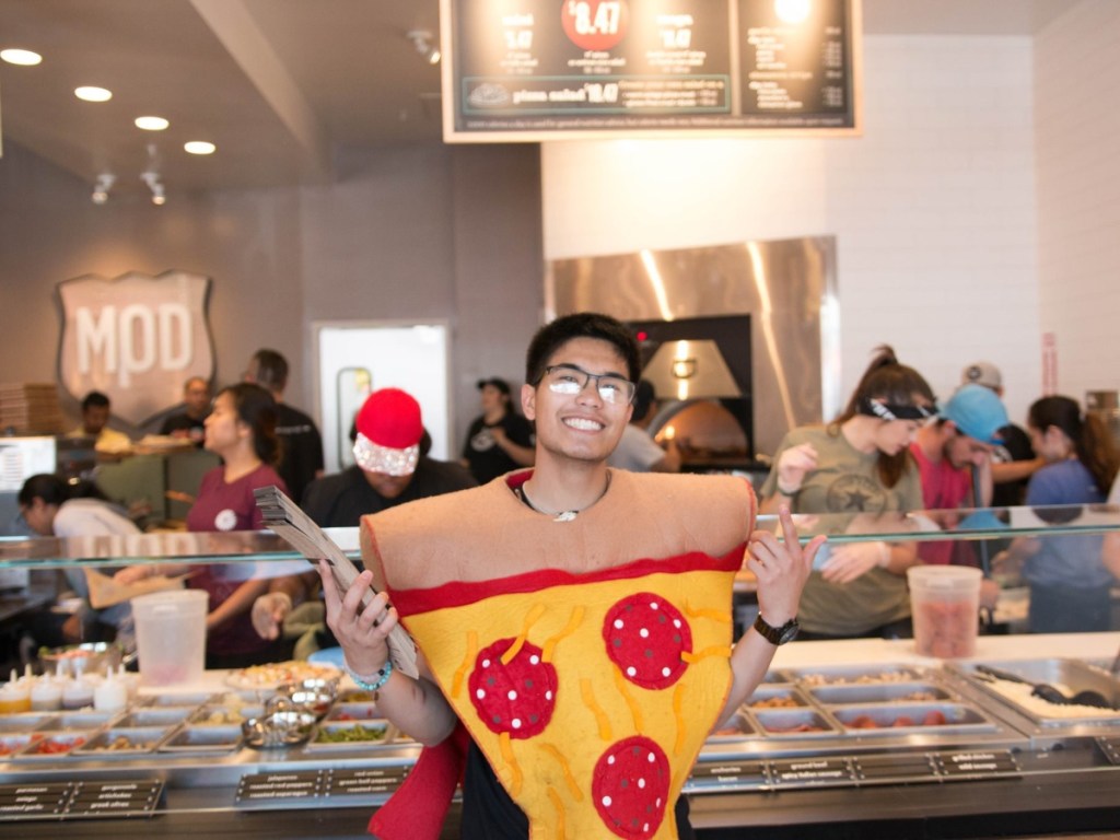 person wearing pizza costume