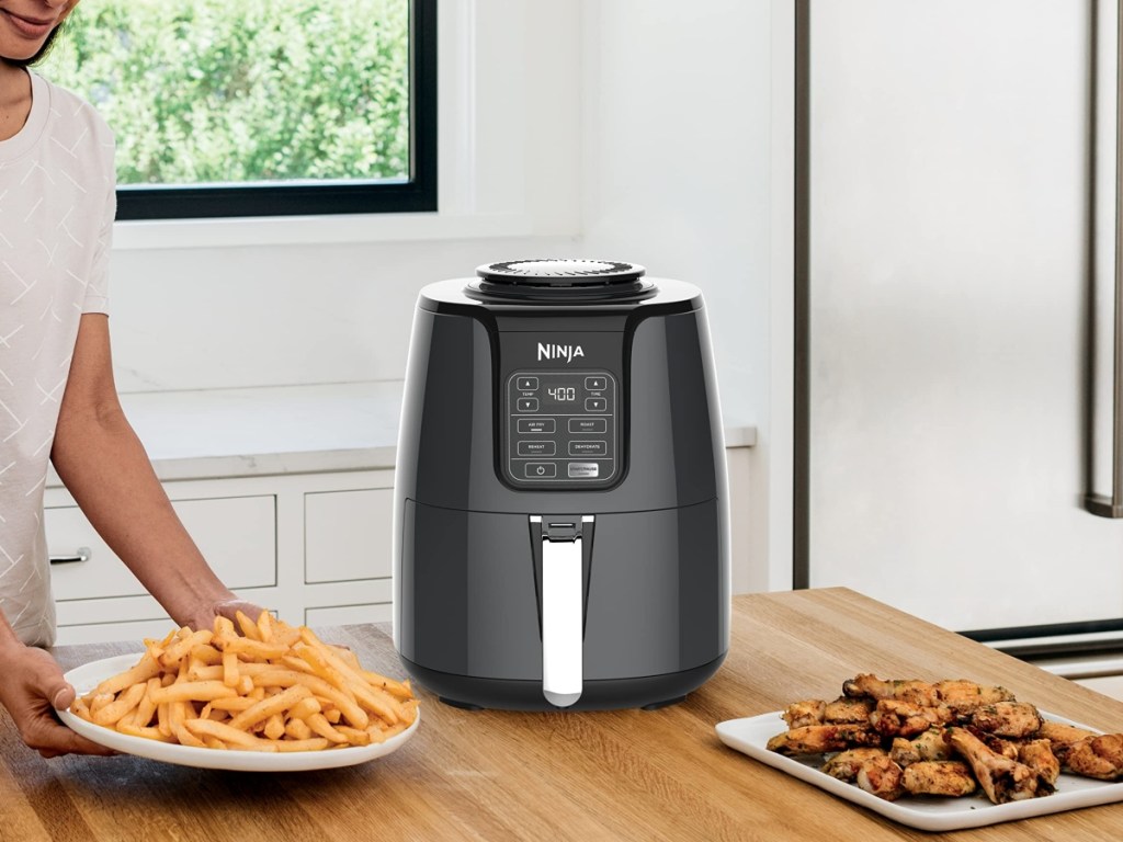 black air fryer on butcher block counter top