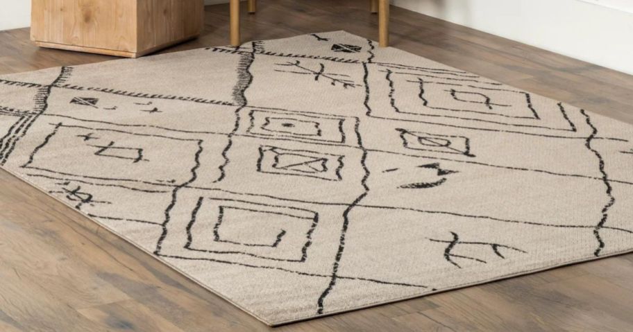 tan and black tribal pattern nuLOOM area rug in living room