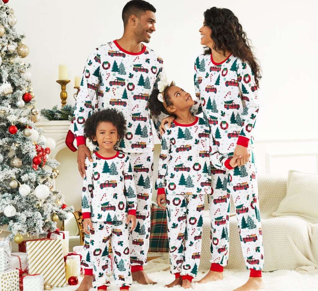 family wearing matching tree print pajamas