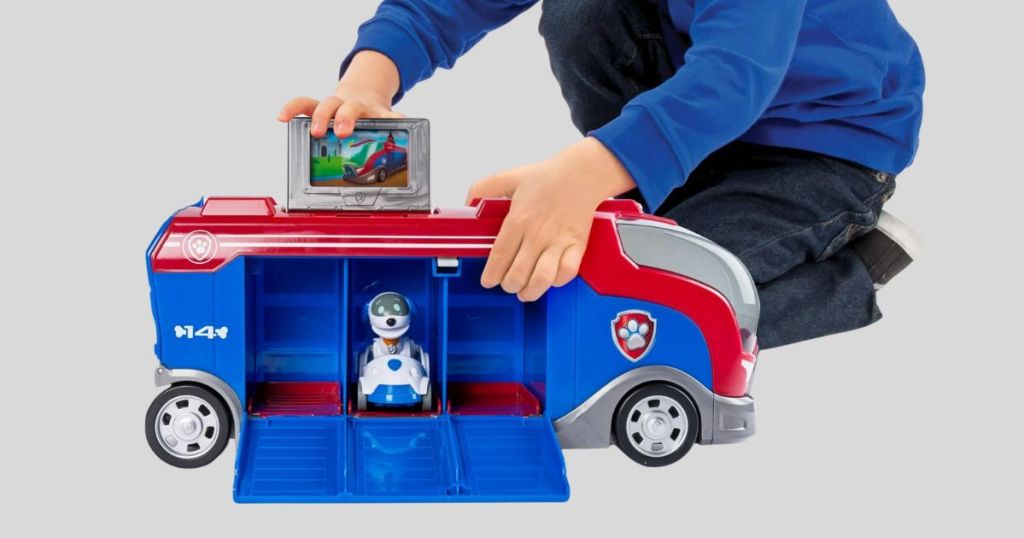 kid playing with Paw Patrol Mission Cruiser Robo Dog and Vehicle