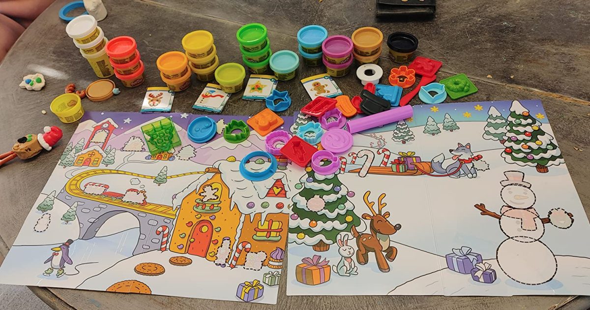contents of the play doh advent calendar spread out on a table