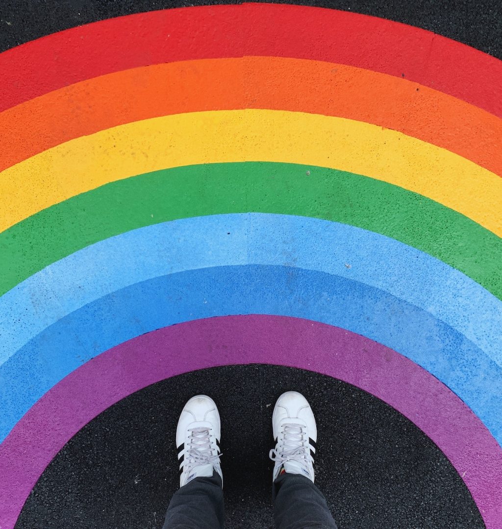 rainbow on sidewalk with adidas feet