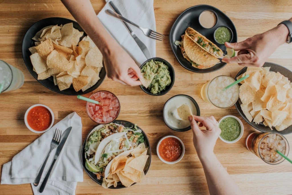top-down view of people eating Mexican food
