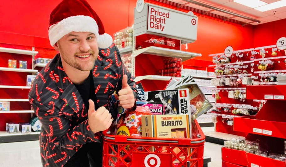 person standing in front of full cart on black friday