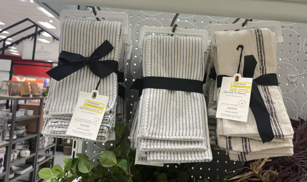 three sets of target clearance magnolia napkins on display in store