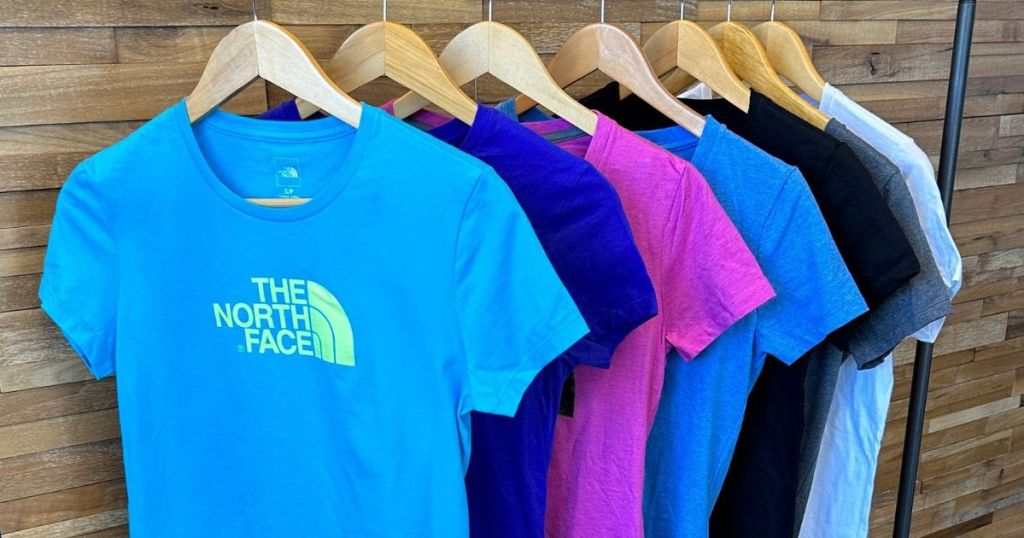 The North Face tees on a rack