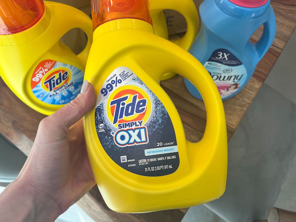 Walgreens tide detergent in woman's hands at the store