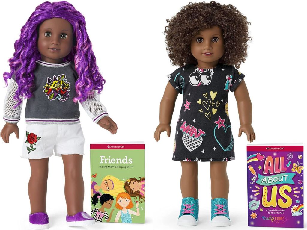 Two American Girl Truly Me Dolls with dark skin and the book the each come with