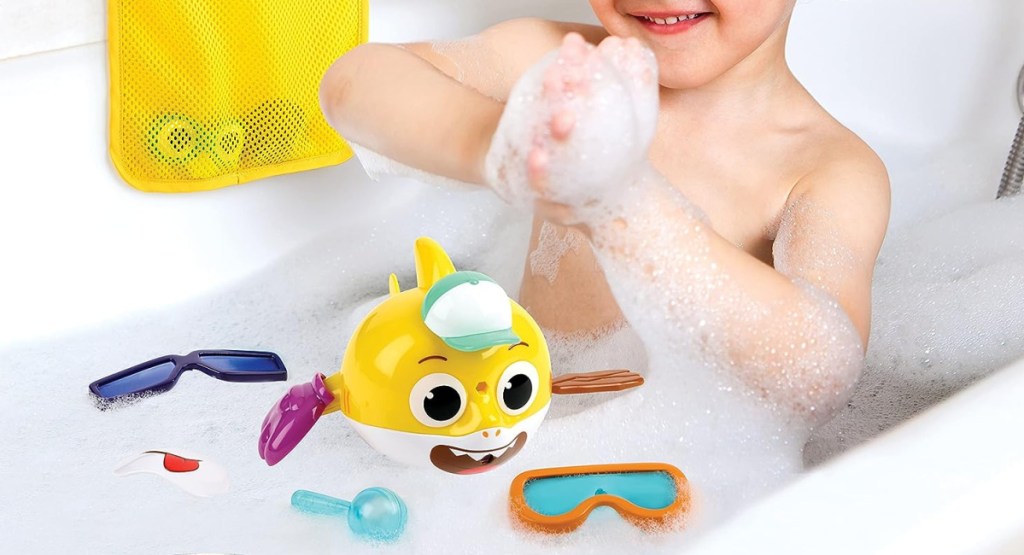 Baby Shark's Big Show! Mix & Match Bath Swimmer 10 Piece Set with baby playing in the tub
