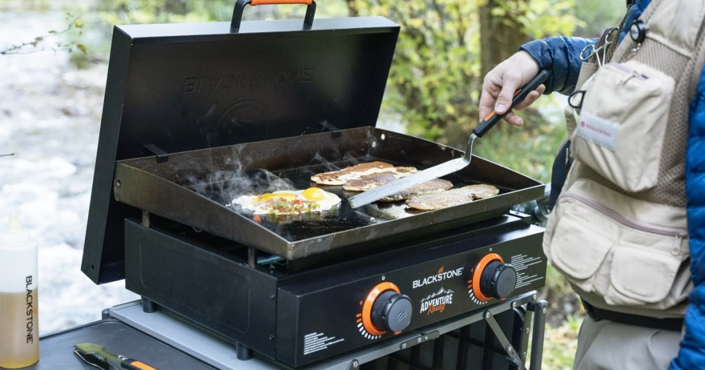 cooking on a portable blackstone grill outdoors
