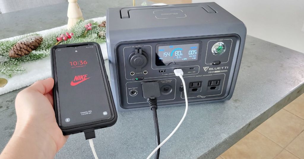 phone plugged into Bluetti Portable Power Station