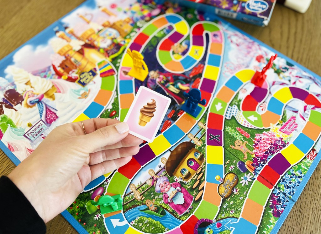 hand holding card to candy land game