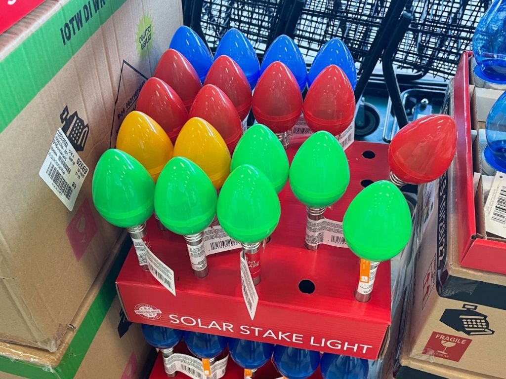 A display box of Christmas light shaped lawn stake lights