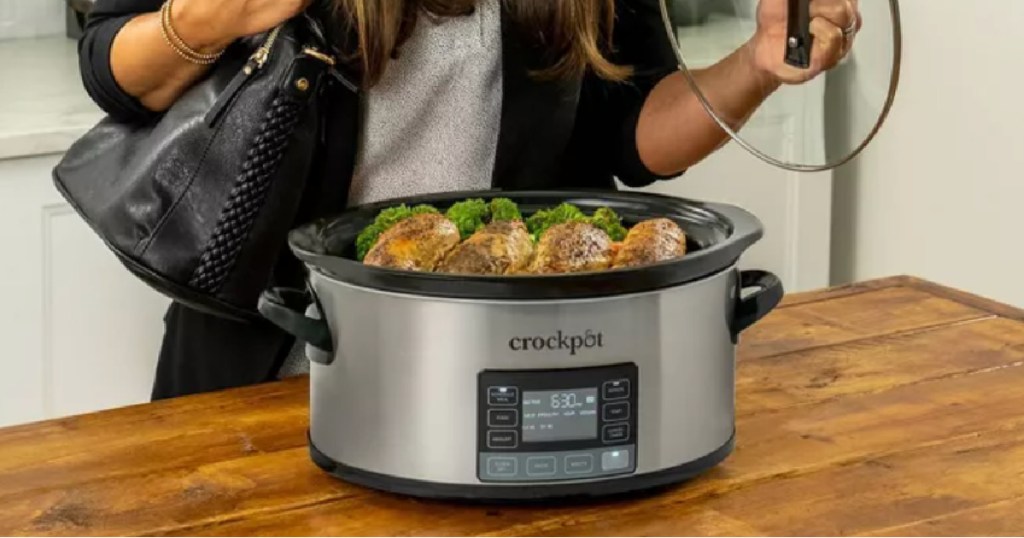 silver slow cooker with food