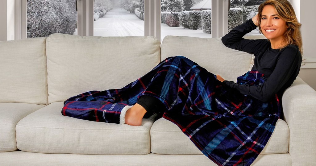 woman on couch under throw blanket with foot pockets