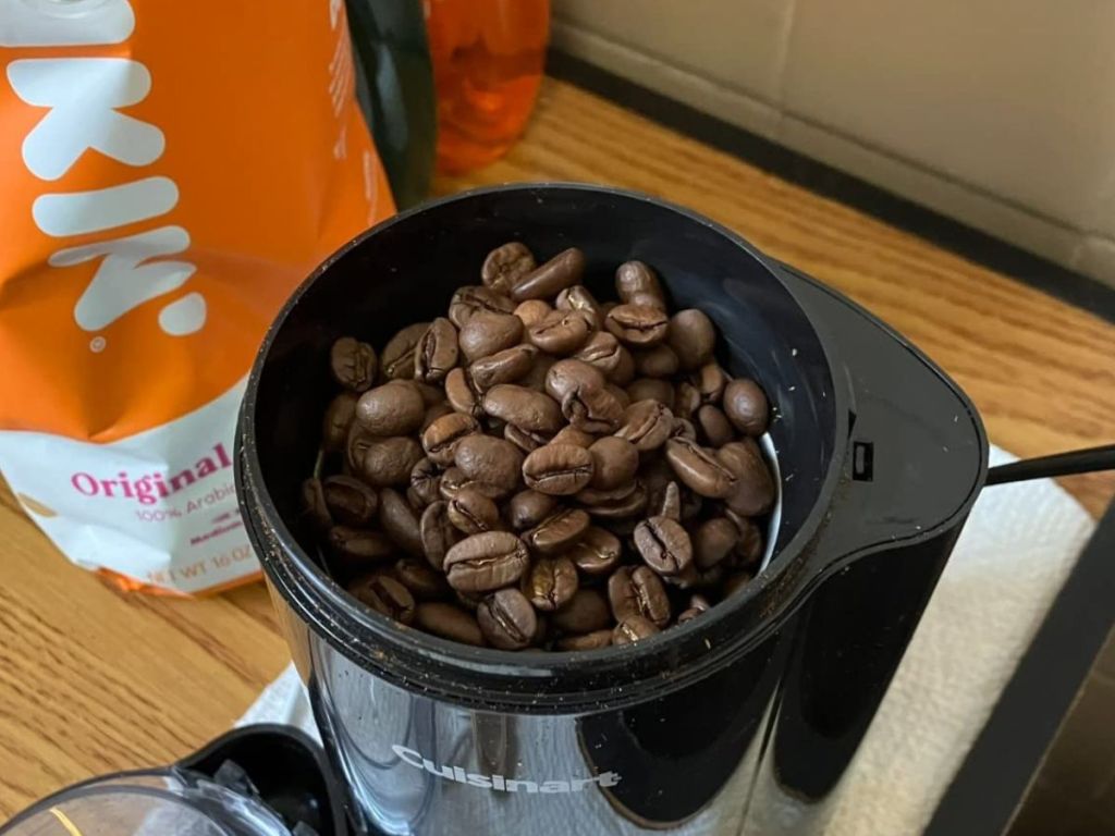A cuisinart coffee bean grinder filled with dunkin coffee beans