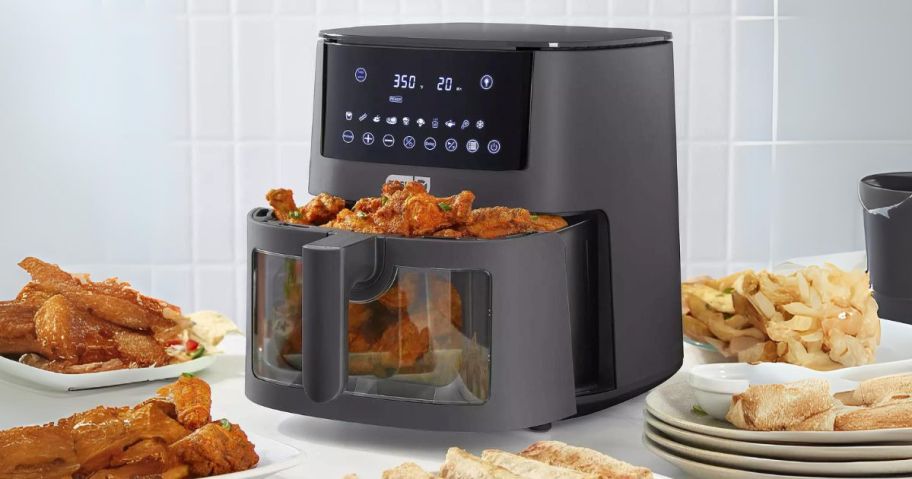 Dash 7-Quart Clear View Digital Air Fryer with food in it