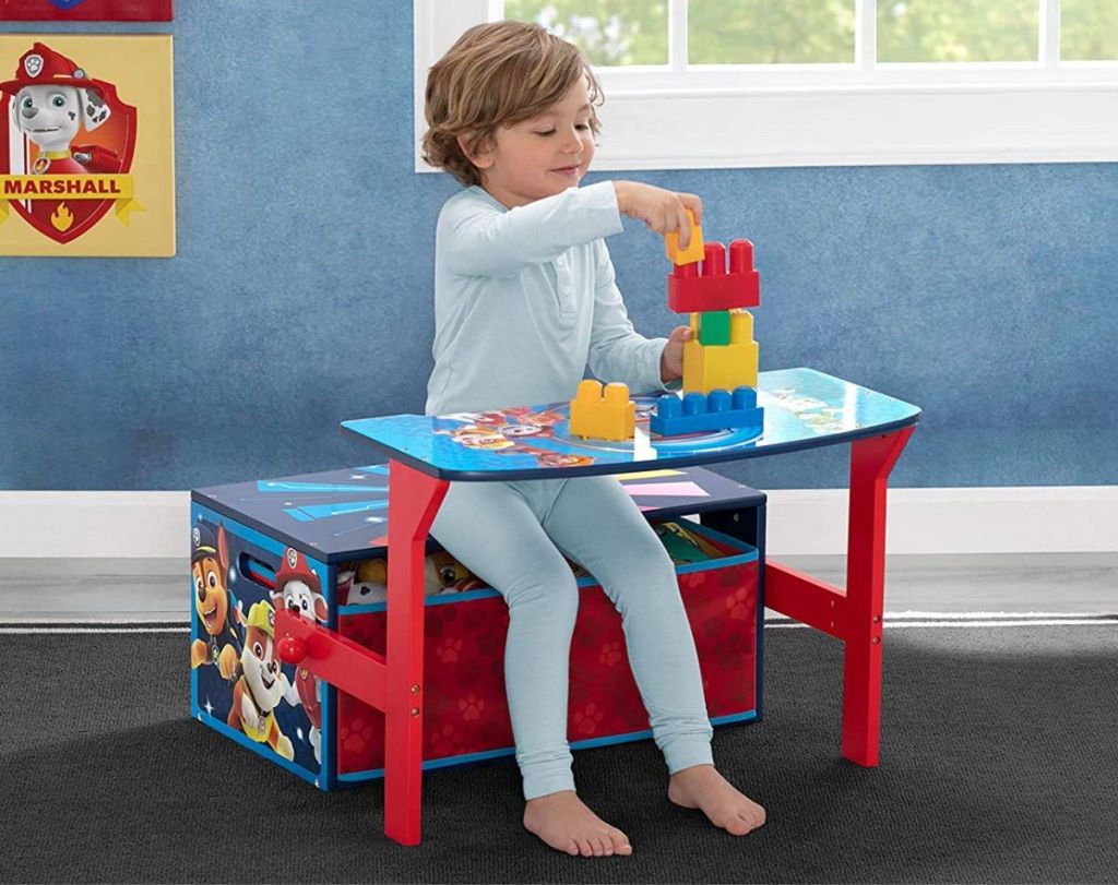 delta children paw patrol bench as desk with little boy sitting and playing