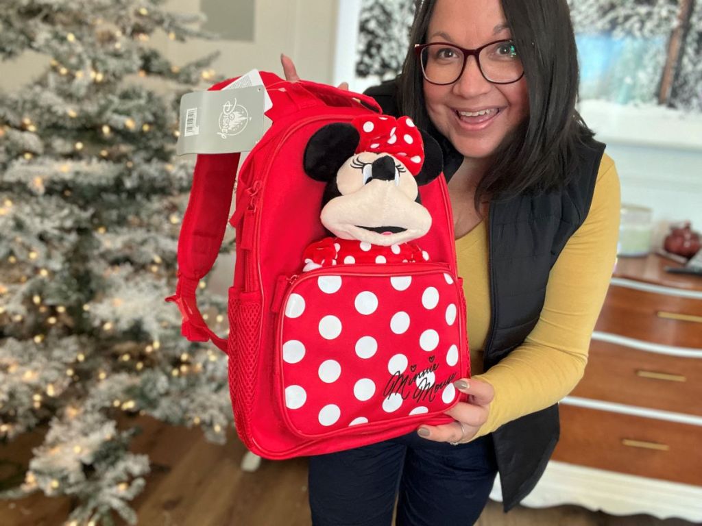 woman holding a Disney Minnie Mouse Backpack