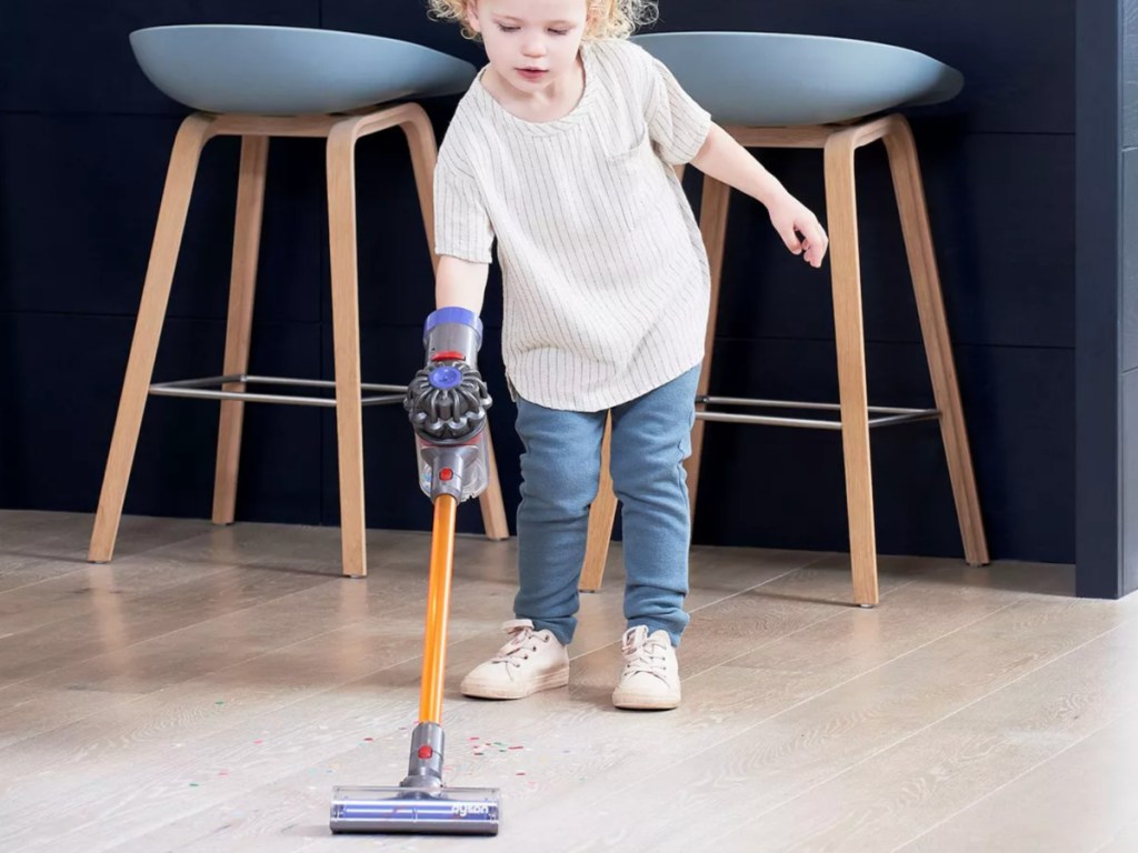 little girl pushing Dyson Cordless Toy Vacuum