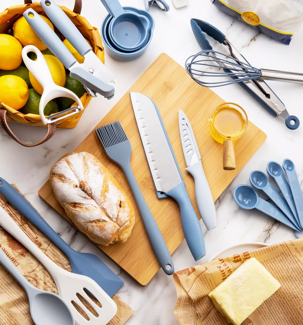 kitchen tools arranged on counter and cutting board