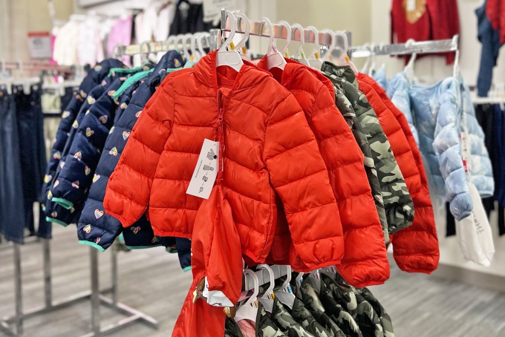 red puffer jackets on display in store
