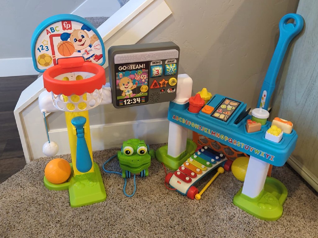 Fisher Price Laugh & Learn Sports Activity Center displayed in living room