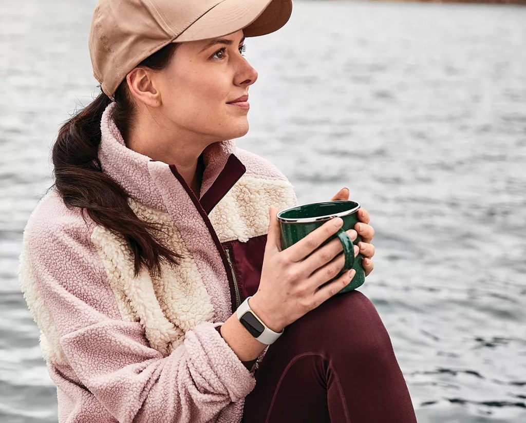 woman wearing a Fitbit Charge 5