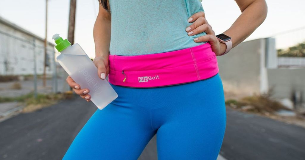 Woman wearing a hot pink running belt