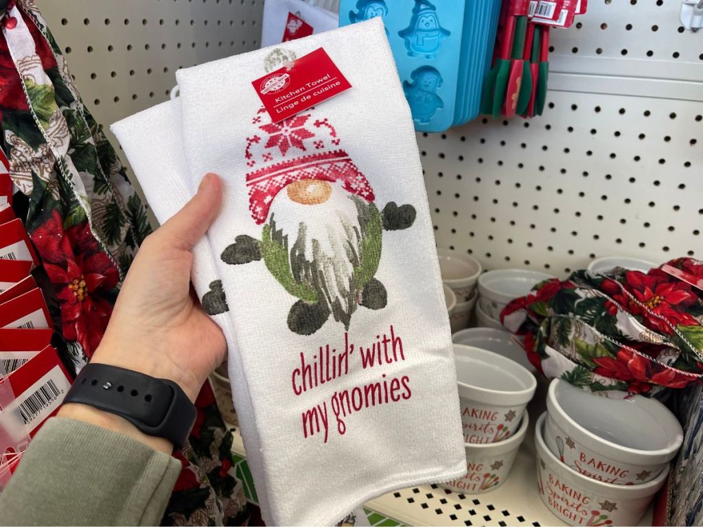 Kitchen towel with an appliquéd gnome on it.