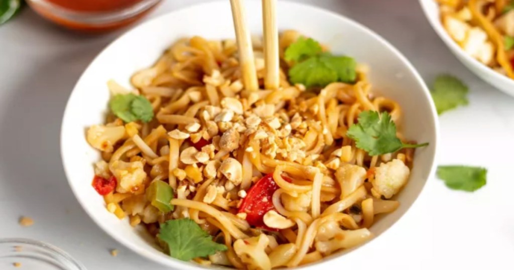 noodles and vegetables in white bowl